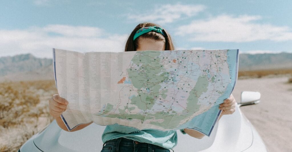 A woman holds a map while traveling through the scenic desert of California, USA.